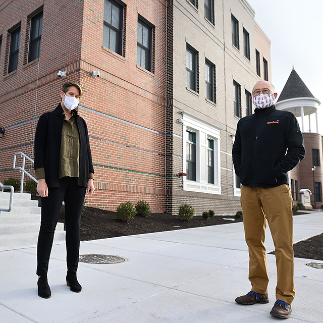 Lindsay Hebert and Albert Wu stand outside the new E. North Avenue headquarters of Roberta’s House, a family grief support center.