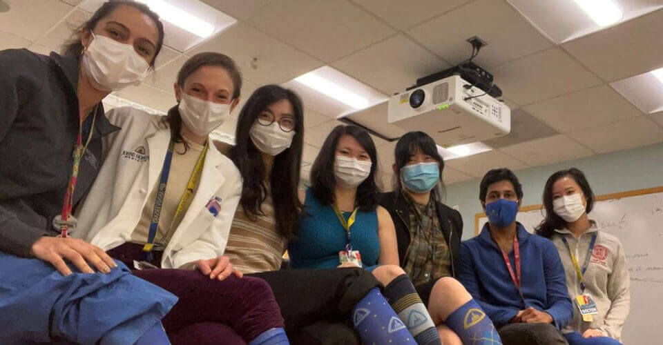 Students showing off Johns Hopkins socks