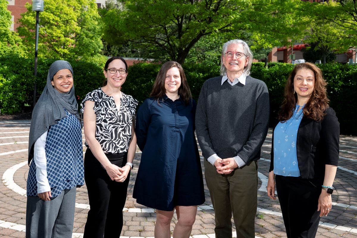 group of four female and one male doctors and researchers