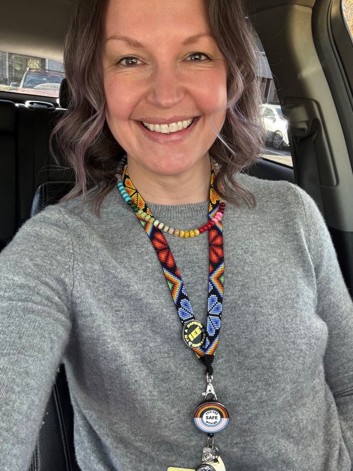 female doctor in her car on house calls