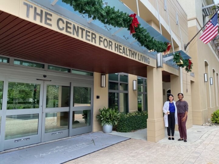 two female doctors outside a medical clinic
