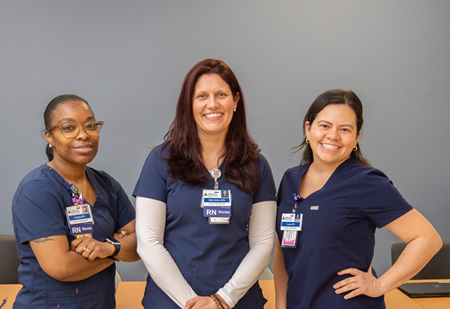 A group of nurses smiling at the camera
