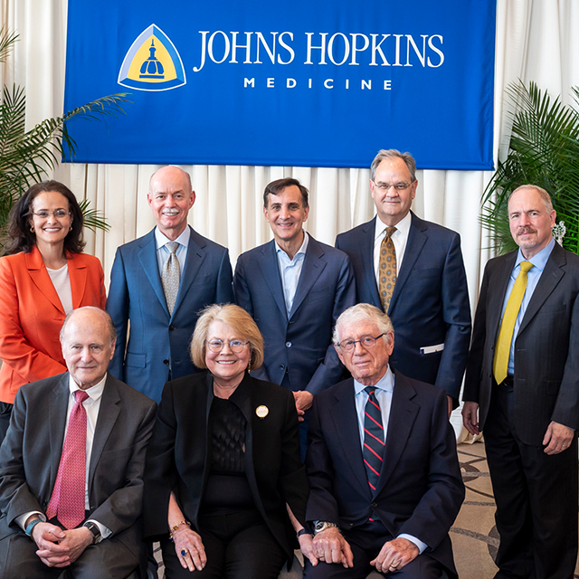 Robert Wise, Grace Anne Dorney- Koppel, and Ted Koppel (front) gather for a photo with Department of Medicine and Johns Hopkins leaders at the professorship dedication.