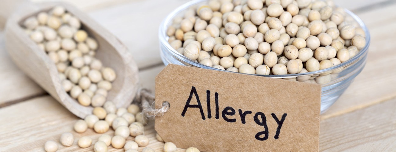 Bowl of soybeans labeled with an allergy sign