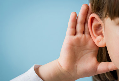 Child's ear listening.