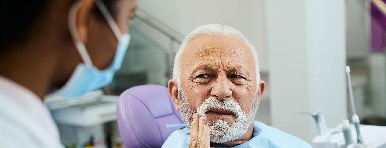 Elderly man with mouth discomfort. 