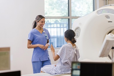 A radiologist talking to a patient