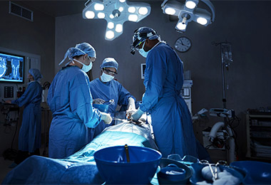 Surgeon's performing a procedure.