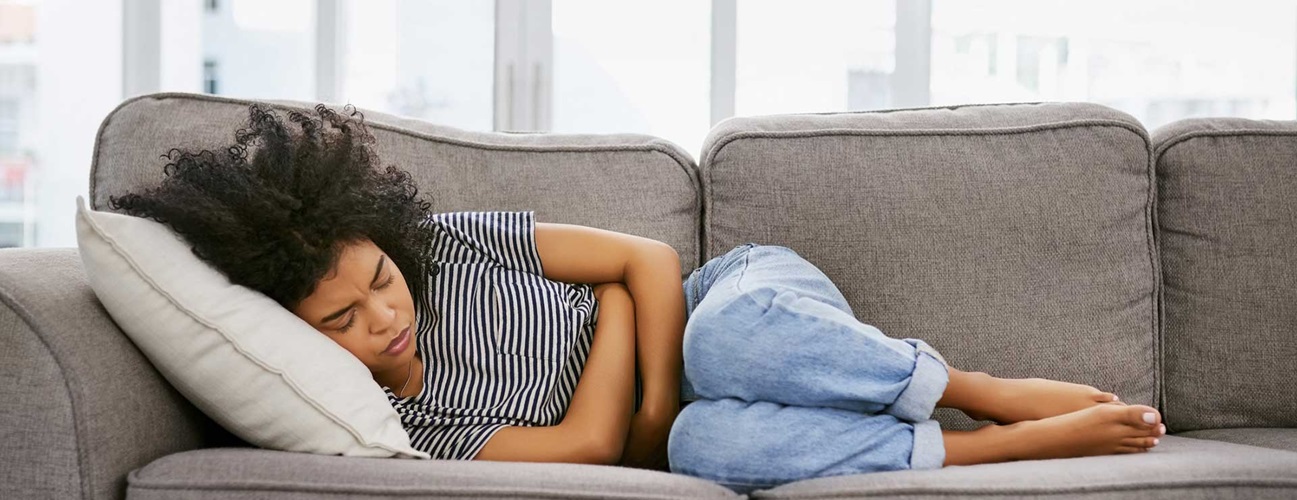 Everything You Need To Know About Period Cramps: Including why they happen,  and how to reduce