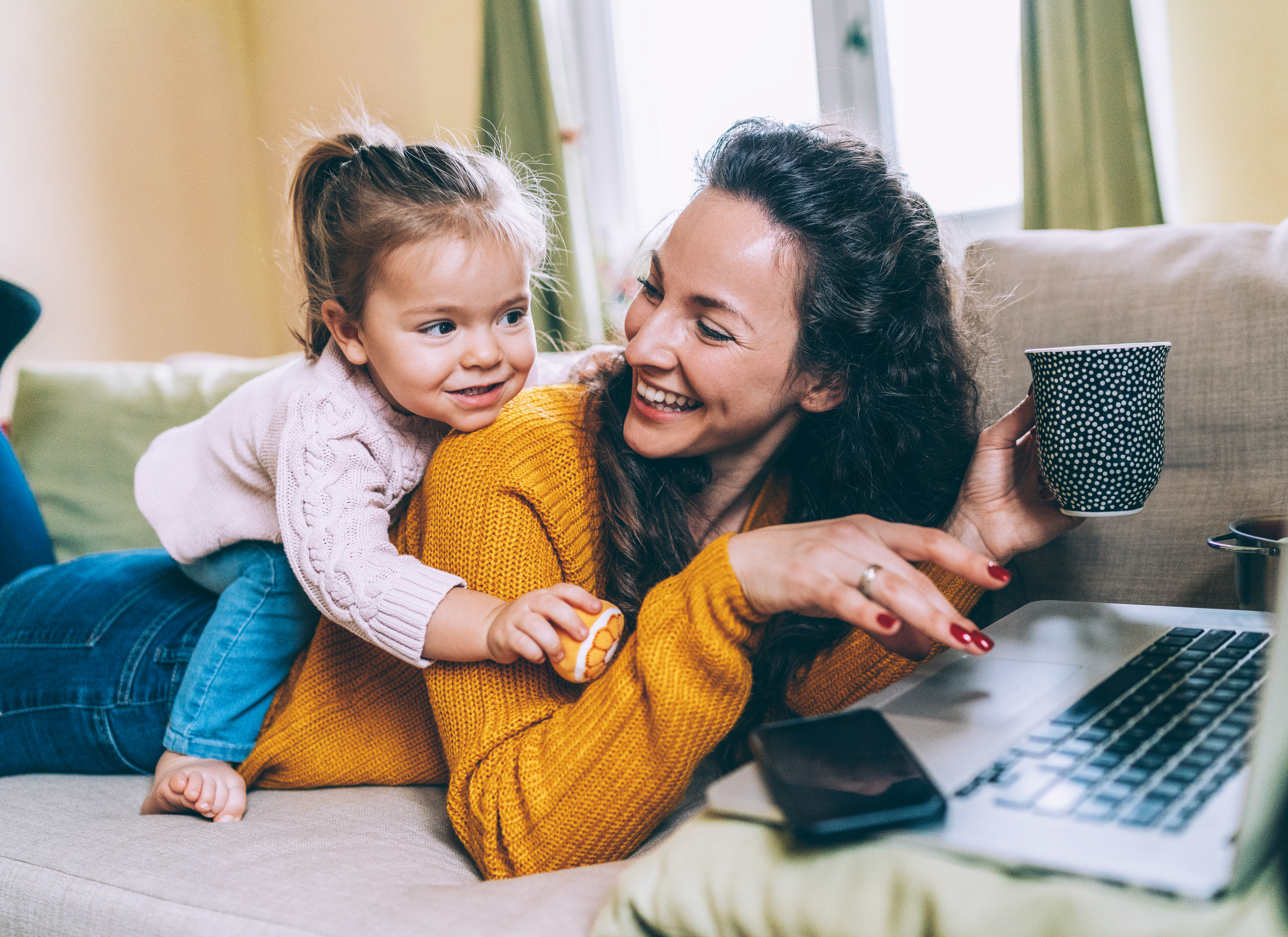 woman and daughter on couch