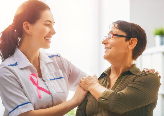 Caring nurse with patient.