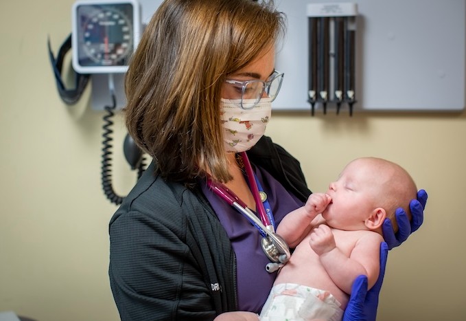 Chief resident with patient in general pediatrics