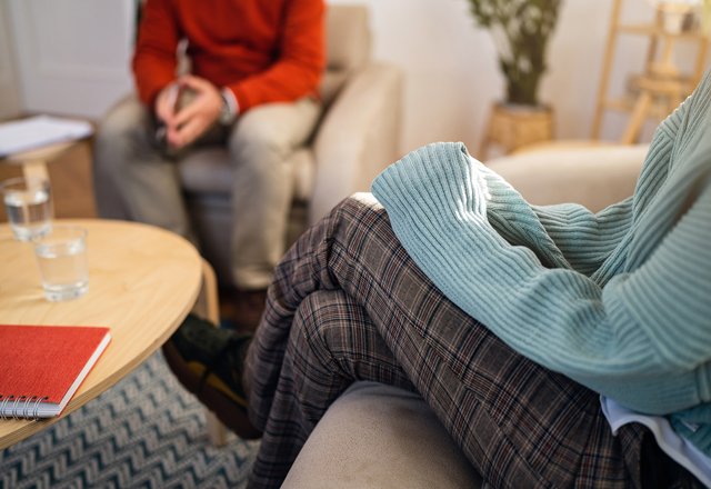 An individual in a therapist's office receiving care