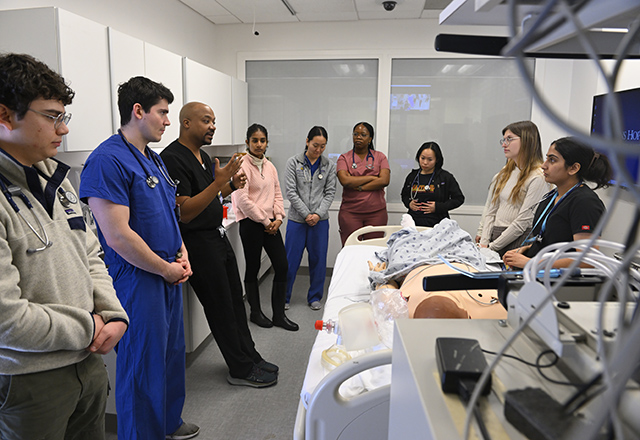 Students learning in the SIM lab