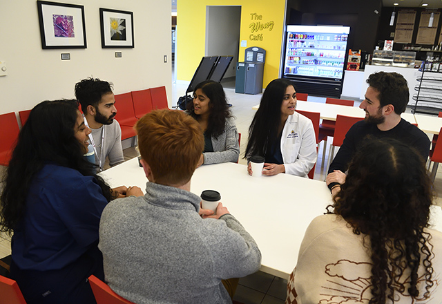 Students discussing something over coffee