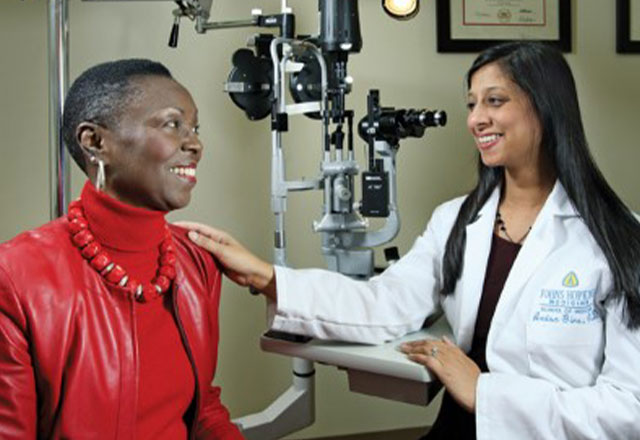 Dr. Anisa Gire with a patient