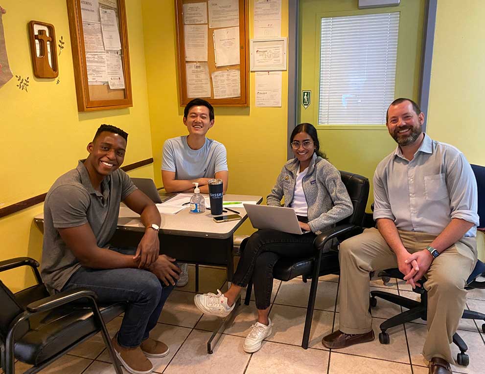 Four members of the vision team seated together