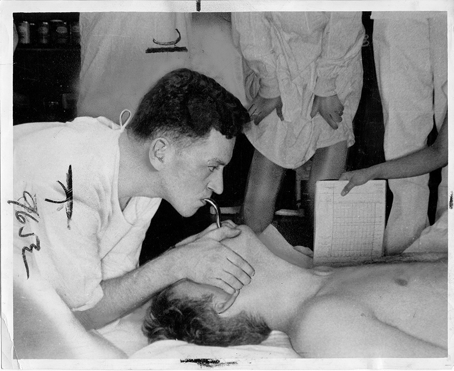 Black and white photo of early CPR training.
