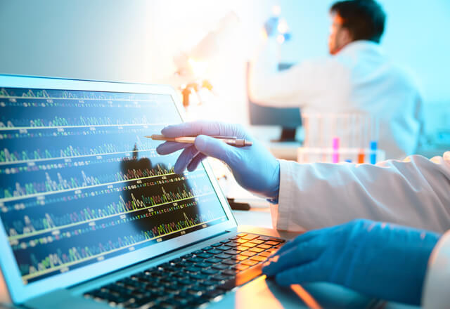 researcher using lab equipment