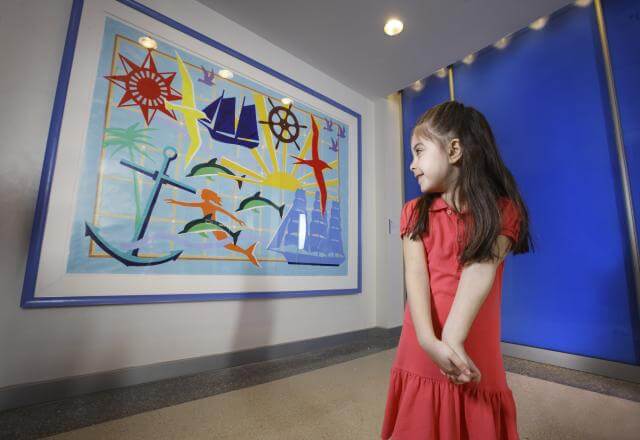 child looking at artwork