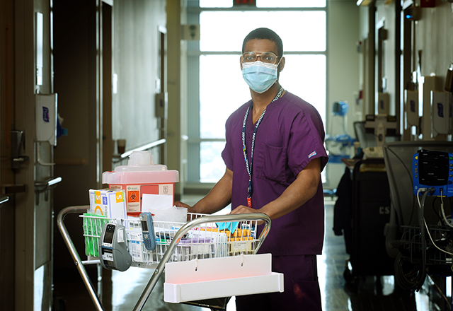 medical scientist holding medical lab materials